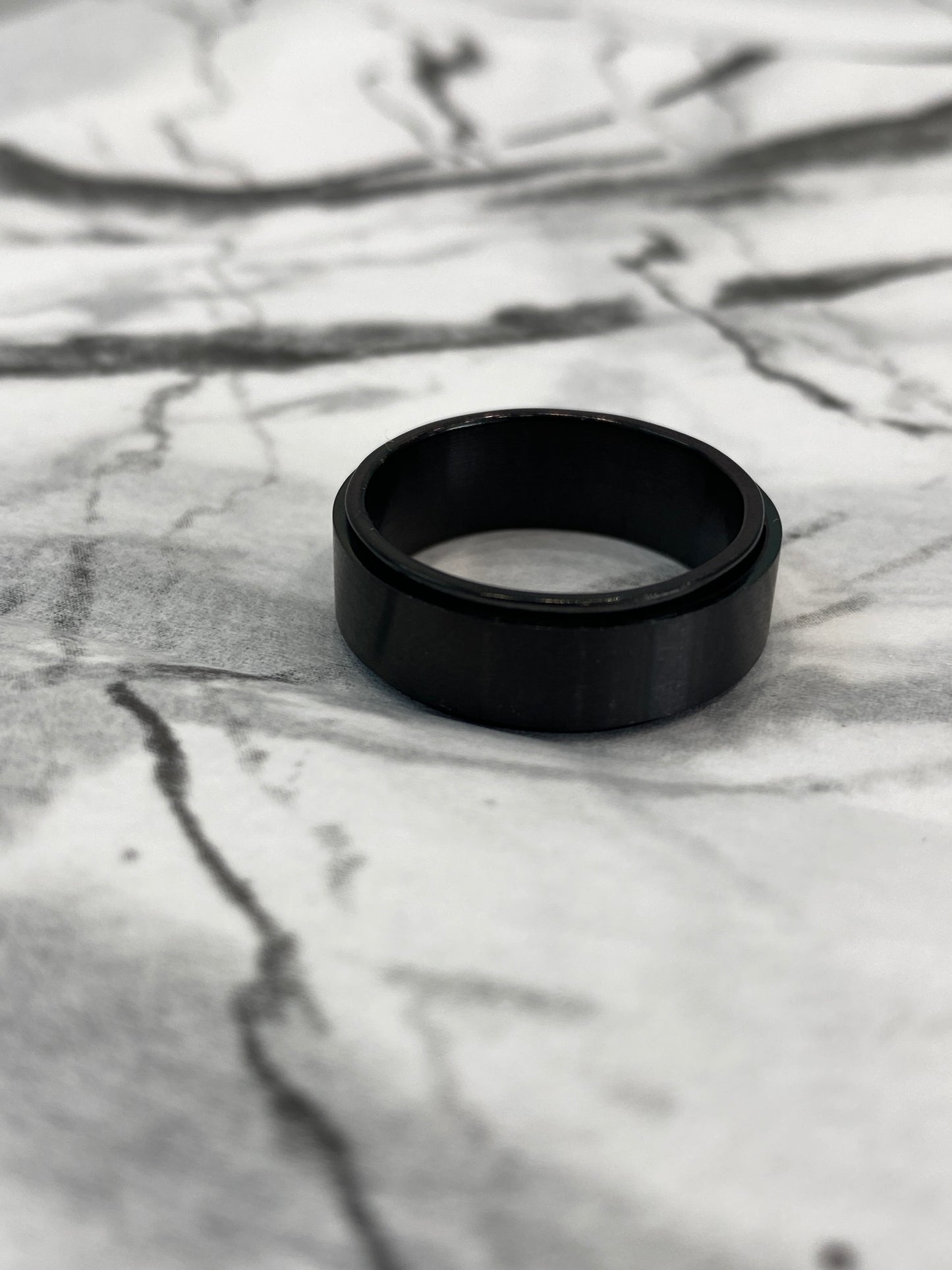 Sleek Spinning Black Ring